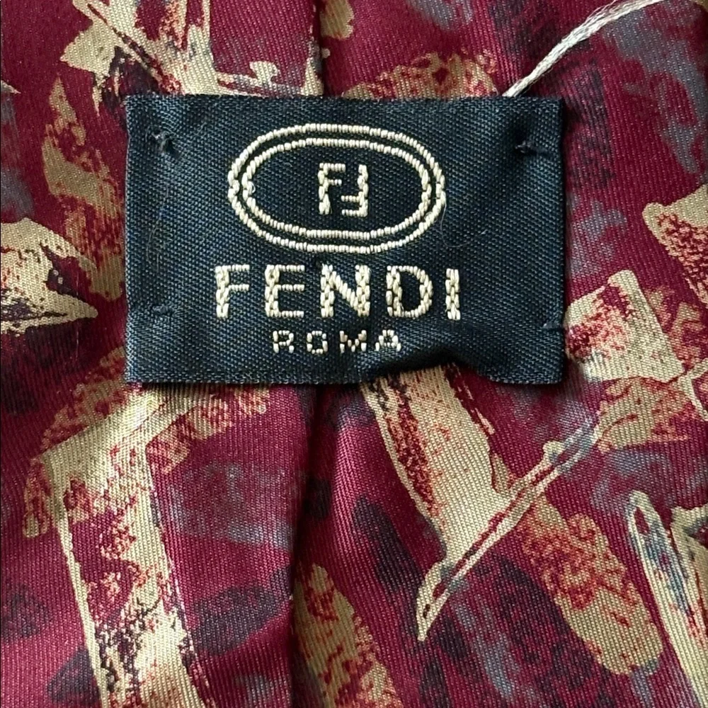 Fendi Burgundy Tie with abstract Pattern of reds, gold and gray